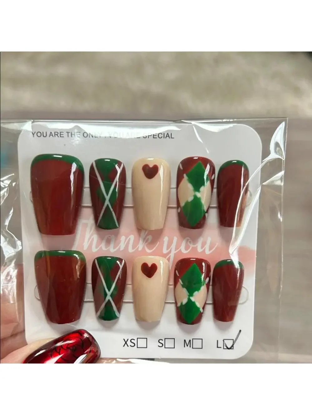 Elegant Handmade Nail Art Set with Red and Green Argyle Accents